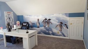 A photographic wall mural can add a lot of visual space to an otherwise small room. And who doesn't love penguins?