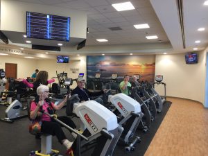 Patients enjoying supervised exercise at Johnston Health's new Cardiopulmonary Rehabilitation Facility are motivated by wall murals in the center. Photo by MagicMurals.com