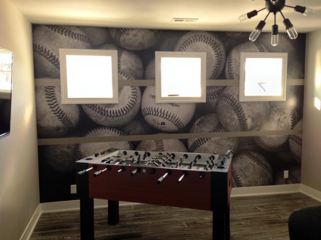 Not every man cave is big enough for a pool table, but a foosball table is a lot of fun too. And, of course, every room is big enough for a wallpaper mural.