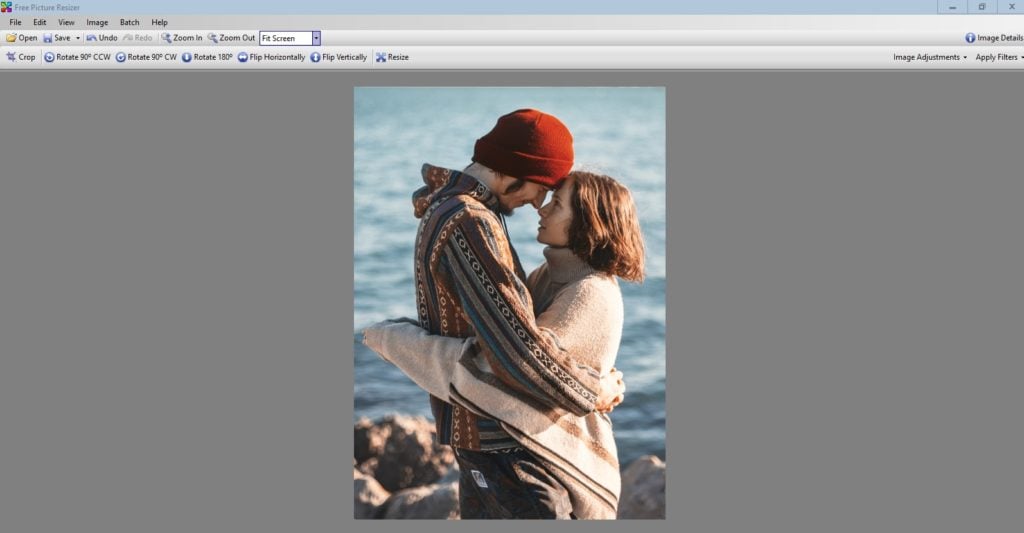 Solution: Crop the photo to focus on the beautiful couple and create a wallpaper mural in a different size.