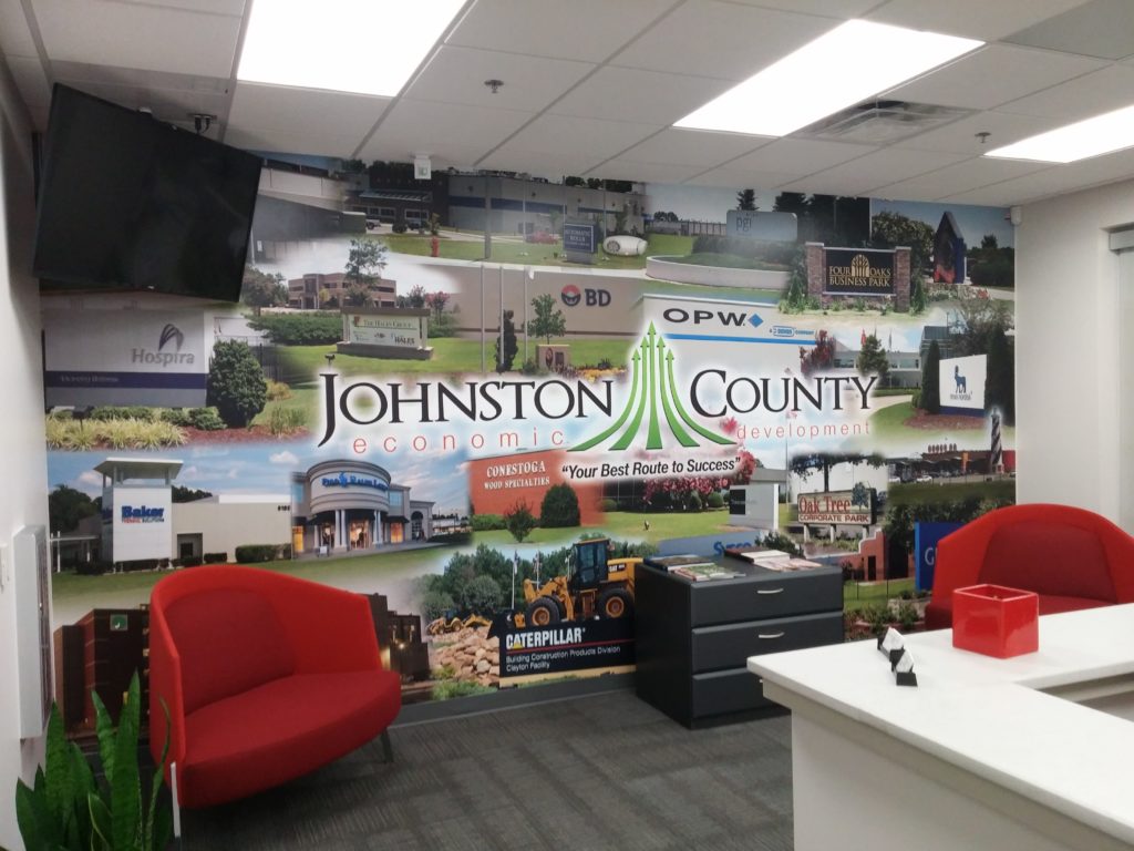 As business trips get cancelled and rescheduled as video calls, a backdrop like this can tell your story without you having to say a word. Thanks to Johnston County Economic Development. Mural by Magic Murals.