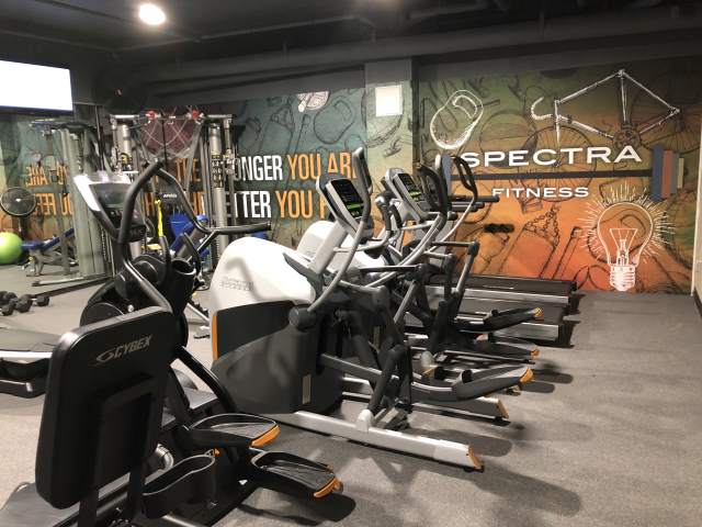 More gyms and personal trainers are going online these days to serve training tips and inspiration to their at-home customers. Boring cement walls and tacky posters won’t cut it when your business can be seen by millions. This gym is at Spectra Plaza, luxury apartments in Hartford, CT developed by Wonder Works Construction. Mural by Magic Murals.