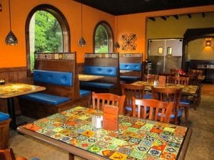 Mi Pueblita tabletops covered with custom talavera tile murals