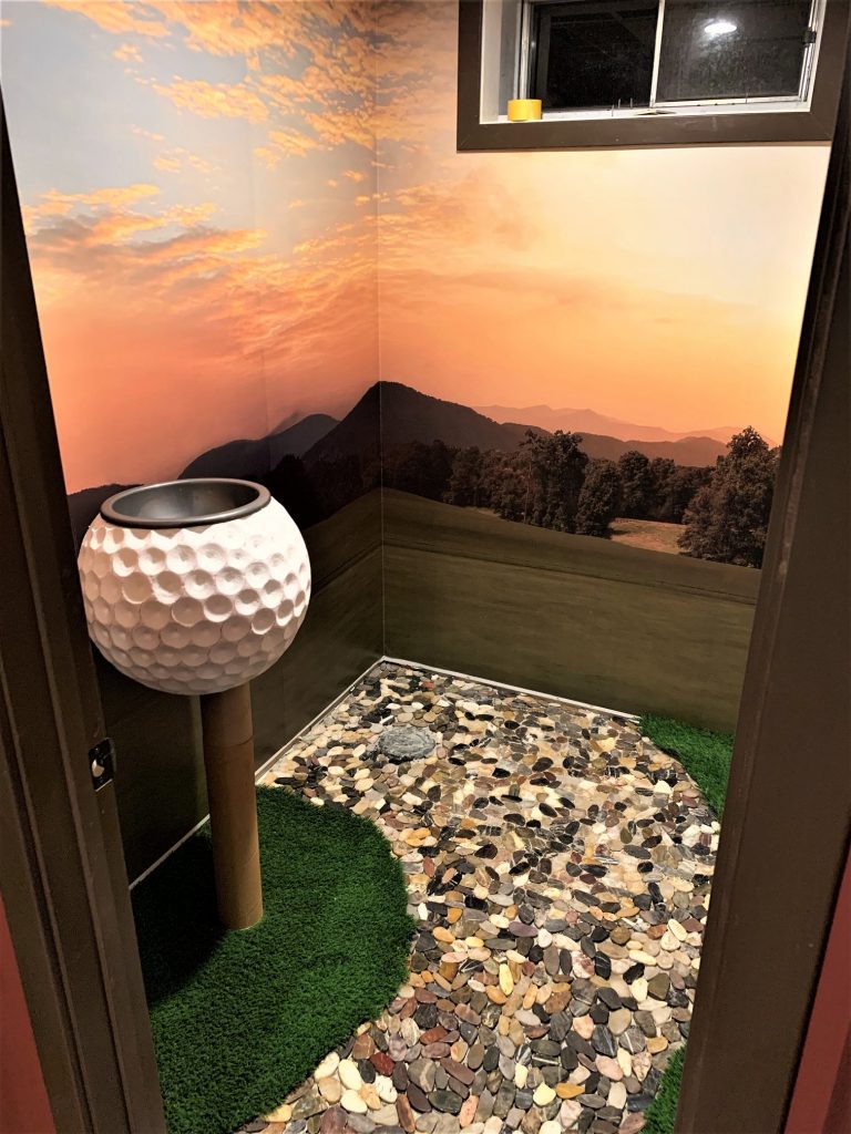 Golf mural in a bathroom.