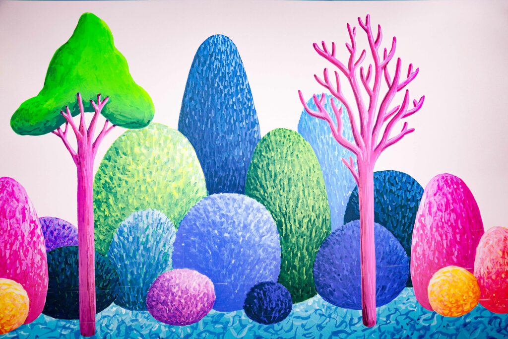 Green Trees, Pink Trees, Blue and Orange Trees cover this whimsical wall mural!