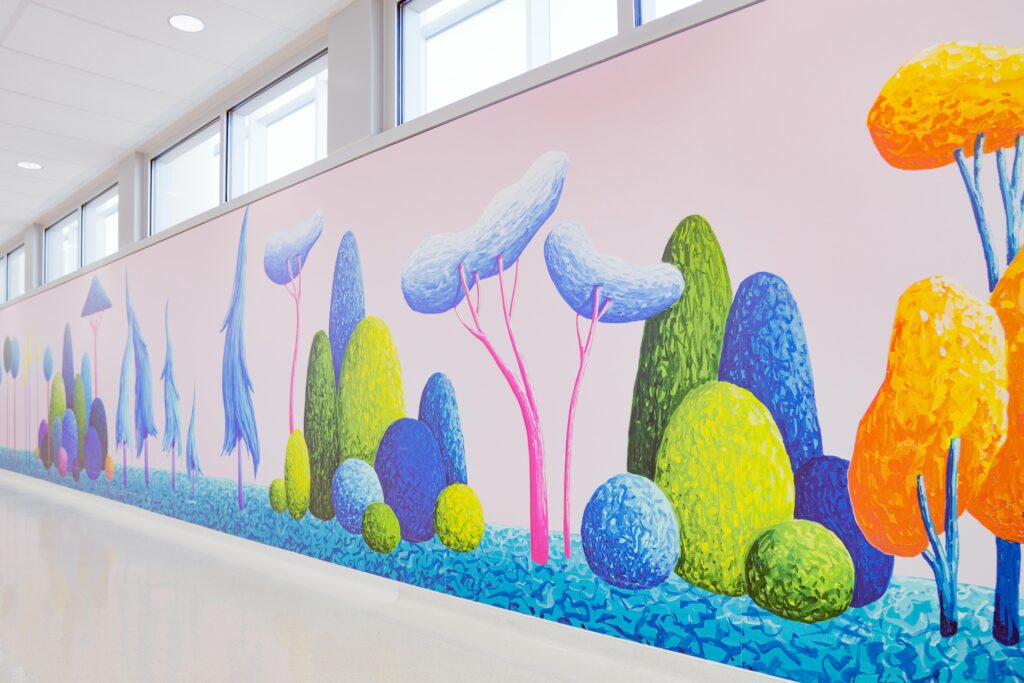 Oddly shaped groups of trees bright and colorful covering the wall mural.