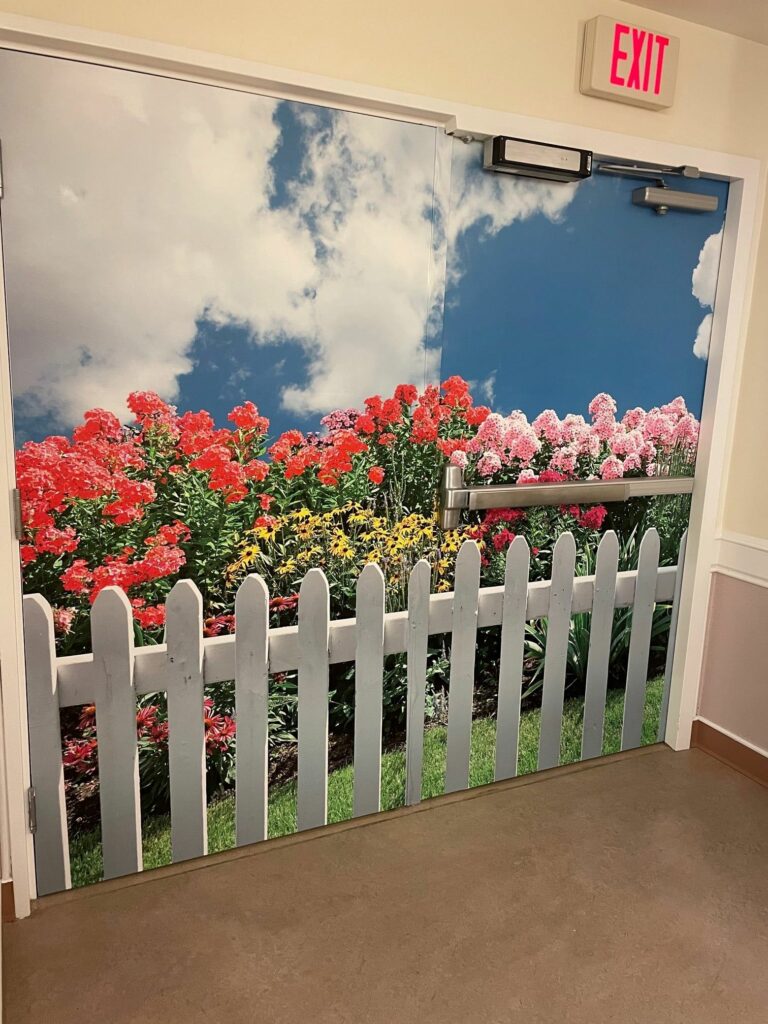 Wooden Fences protects this garden on a brightly colored mural.