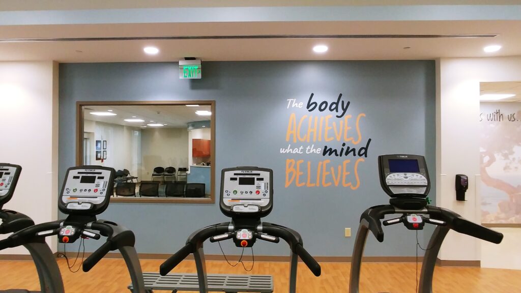 "The body achieves what the mind believes" contour cut mural.